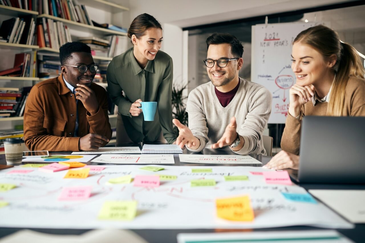 happy creative marketing team working on new business project in the office .jpg